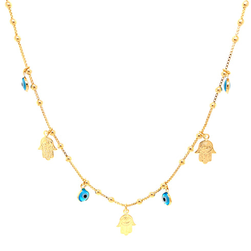 The "Hamsa Hands and Blue Evil Eye Charms Pendant Necklace" is a 14k gold-filled piece, featuring small Hamsa hand charms and blue evil eye beads, evenly distributed along its delicate chain.